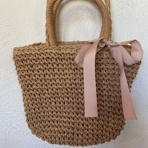 Elegant Tan Woven Tote Bag with Pink Ribbon